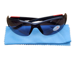 Black sunglasses with red accents on a blue cleaning cloth